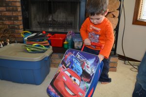 Vacation Minimalists - Benjamin getting his basics ready for the trip.